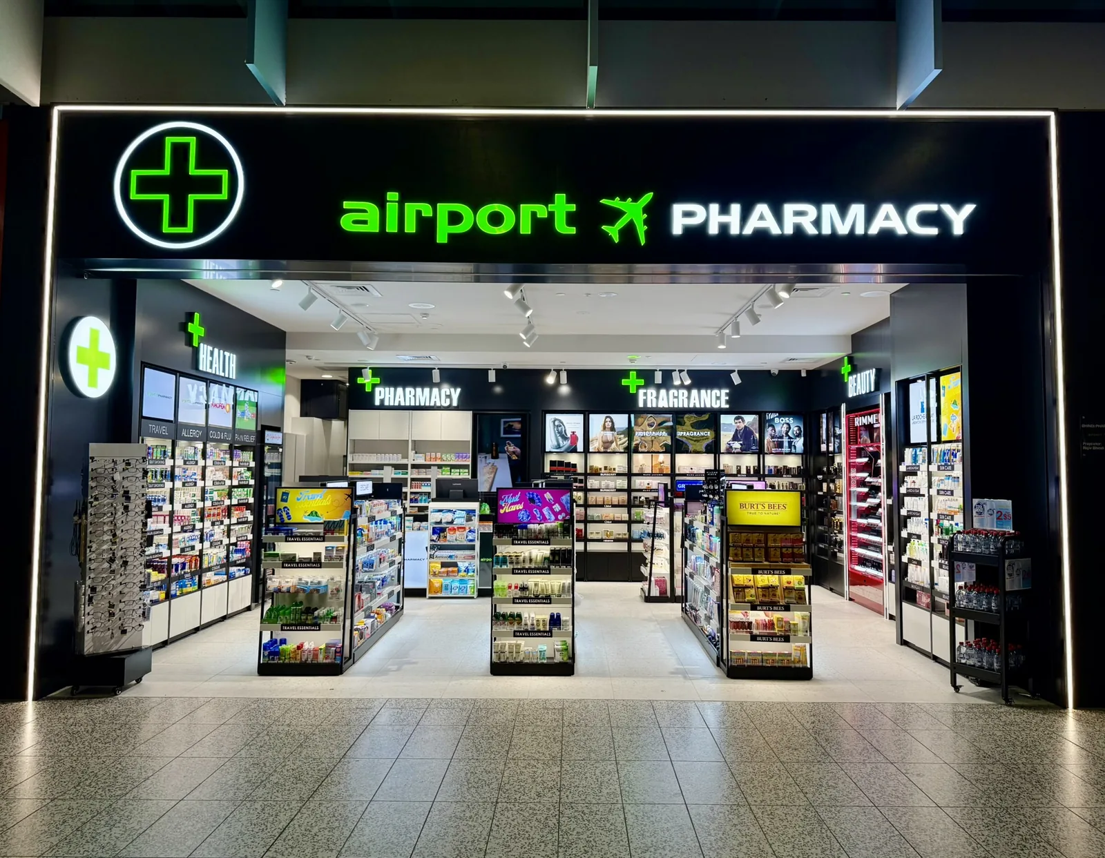 Airport Pharmacy shopfront with green pharmacy cross at Melbourne Airport Terminal 4